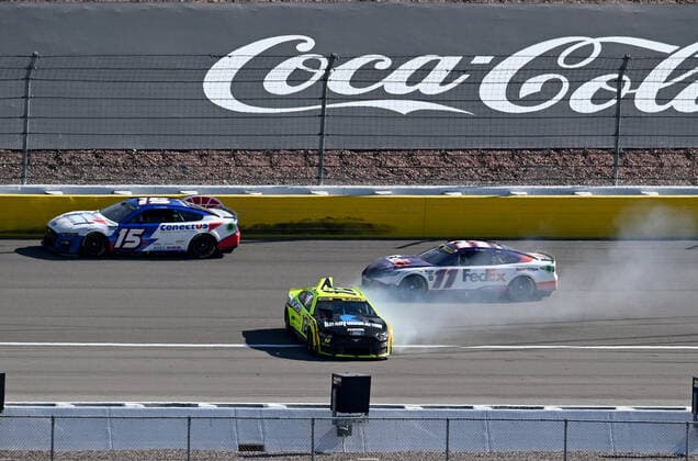 LAS VEGAS, NV - OCTOBER 16: Ryan Blaney ( 12 Team Penske Menards Knauf Ford) spins as JJ Yeley ( 15 Rick Ware Racing ConectUS Kyocera Ford) and Denny Hamlin ( 11 Joe Gibbs Racing FedEx Office Toyota) drive past during the NASCAR, Motorsport, USA Cup Series Playoff South Point 400 Sunday October 16, 2022 at Las Vegas Motor Speedway in Las Vegas, Nevada. (Photo by Will Lester Icon Sportswire) AUTO: OCT 16 NASCAR Cup Series Playoff South Point 400 Icon2210163641