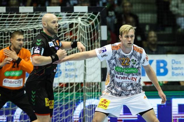 Marian Michalczik TSV Hannover Burgdorf,22 vs Oscar Bergendahl SC Magdeburg,54 Handball Bundesliga Season 2023 2024 SC Magdeburg vs TSV Hannover Burgdorf at GETEC Arena in Magdeburg Action,Handball,Germany,15 10 2023