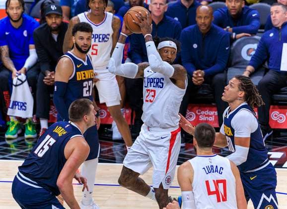 October 19, 2023, Los Angeles, California, USA: Robert Covington 23 of the Los Angeles Clippers passes the ball during their preseason NBA, Basketball Herren, USA game against the Denver Nuggets on Thursday October 19, 2023 at Crypto.com Arena in Los Angeles, California. Clippers lose to Nuggets, 90-103. ARIANA RUIZ PI Los Angeles USA - ZUMAp124 20231019_zaa_p124_025 Copyright: xArianaxRuizx