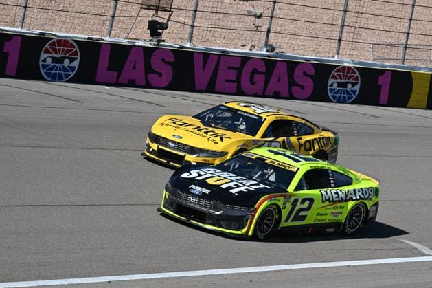 LAS VEGAS, NV - OCTOBER 20: Ryan Blaney ( 12 Team Penske Menards Great Stuff Ford) and Noah Gragson ( 10 Stewart Haas Racing Fanttik Ford) during the South Point 400 NASCAR, Motorsport, USA Cup Series playoff race on October, 20, 2024, at Las Vegas Motor Speedway in Las Vegas, NV. (Photo by Gary Nastase LVMS Icon Sportswire) AUTO: OCT 20 NASCAR Cup Series South Point 400 EDITORIAL USE ONLY Icon299241020420