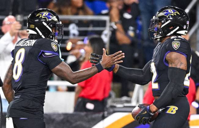 Baltimore Ravens running back Derrick Henry (22) celebrates with quarterback Lamar Jackson (8) after a 28-yard touchdown against the Detroit Lions during the first quarter at M&T Bank Stadium in Baltimore, Maryland, on Monday, September 22, 2025. BAL20250922117 DAVIDxTULIS