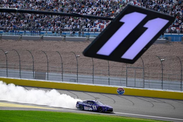 LAS VEGAS, NV - MARCH 15: Denny Hamlin ( 11 Joe Gibbs Racing Yahoo! Toyota) celebrates with a burnout down the front straight after winning the NASCAR, Motorsport, USA Cup Series Pennzoil 400 on March 15, 2026, at Las Vegas Motor Speedway in Las Vegas, NV. (Photo by Will Lester Icon Sportswire) AUTO: MAR 15 NASCAR Cup Series Pennzoil 400 EDITORIAL USE ONLY Icon24031515434