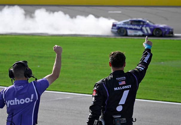 LAS VEGAS, NV - MARCH 15: Denny Hamlin ( 11 Joe Gibbs Racing Yahoo! Toyota) celebrates with a burnout down the front straight as his crew reacts after winning the NASCAR, Motorsport, USA Cup Series Pennzoil 400 on March 15, 2026, at Las Vegas Motor Speedway in Las Vegas, NV. (Photo by Will Lester Icon Sportswire) AUTO: MAR 15 NASCAR Cup Series Pennzoil 400 EDITORIAL USE ONLY Icon24031515478