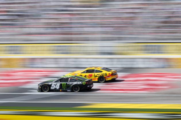 LAS VEGAS, NV - MARCH 15: Ty Gibbs ( 54 Joe Gibbs Racing Monster Energy Toyota) and Todd Gilliland ( 34 Front Row Motorsports Love s Travel Stops Ford) drive during the NASCAR, Motorsport, USA Cup Series Pennzoil 400 race on March 15, 2026, at Las Vegas Motor Speedway in Las Vegas, NV. (Photo by Karl Anderson Icon Sportswire) AUTO: MAR 15 NASCAR Cup Series Pennzoil 400 EDITORIAL USE ONLY Icon272260315112