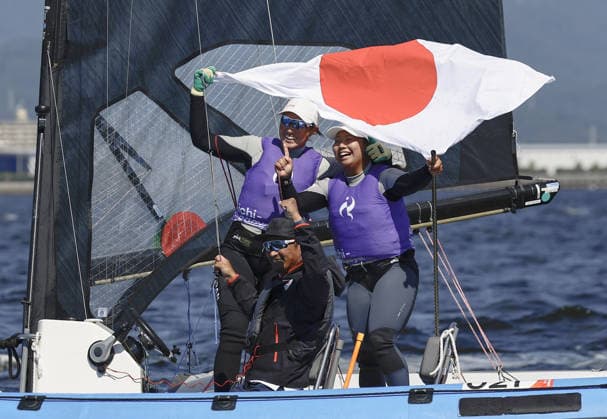 Aichi-Nagoya Asian Games: Sailing Japanese sailors Misaki Tanaka (R) and Sera Nagamatsu celebrate after winning gold in the Aichi-Nagoya Asian Games women s skiff at Kaiyoh Yacht Harbor in Gamagori in Aichi Prefecture, central Japan, on Oct. 1, 2026.  A14AA0005629600P