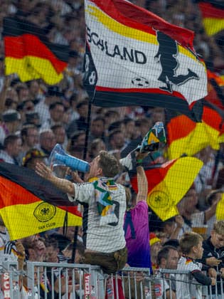 Munich, Germany October 1, 2026 UEFA Nations League 2026–2027 League Phase Group A2 Match 3 Germany vs. Serbia In the photo, fans of the German national team wave flags and cheer from the standing sections in the curve. DFB and DFL regulations prohibit any use of photographs as image sequences and or quasi-video. Allianz Arena, Bayern Copyright: xFotostandx xSchäferx