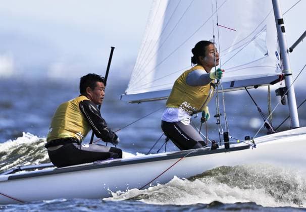 Aichi-Nagoya Asian Games: Sailing Japanese sailors Yurie Seki (R) and Tetsuya Isozaki compete en route to winning the Aichi-Nagoya Asian Games mixed dinghy gold off Kaiyoh Yacht Harbor in Gamagori in Aichi Prefecture, central Japan, on Oct. 2, 2026.  A14AA0005629730P