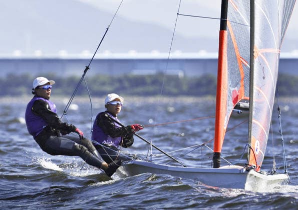Aichi-Nagoya Asian Games: Sailing Japanese sailors Natsumi Funazawa (R) and Natsuko Funazawa compete en route to winning the Aichi-Nagoya Asian Games girls skiff silver off Kaiyoh Yacht Harbor in Gamagori in Aichi Prefecture, central Japan, on Oct. 2, 2026.  A14AA0005629823P