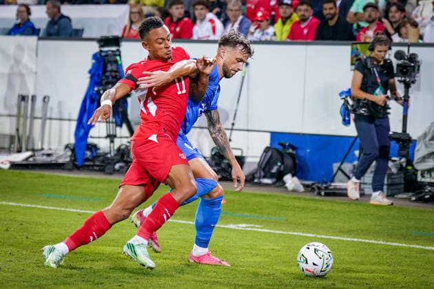 Soccer: UEFA Nations League 2026–2027, Matchday 3: Switzerland vs. Slovenia at Thermoplan Arena Lucerne—Dan Ndoye (Switzerland, No. 11) and David Brekalo (Slovenia, No. 23) in a tackle Copyright: xJOERANxSTEINSIEKx