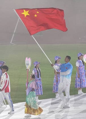 (261004) -- NAGOYA, Oct. 4, 2026 -- Flag-bearer of the delegation of China Bi Kun parades into the stadium during the closing ceremony of the 20th Asian Games Aichi-Nagoya 2026 in Nagoya, Japan, Oct. 4, 2026. ) (SP)JAPAN-NAGOYA-ASIAN GAMES-CLOSING CEREMONY LuoxYuan