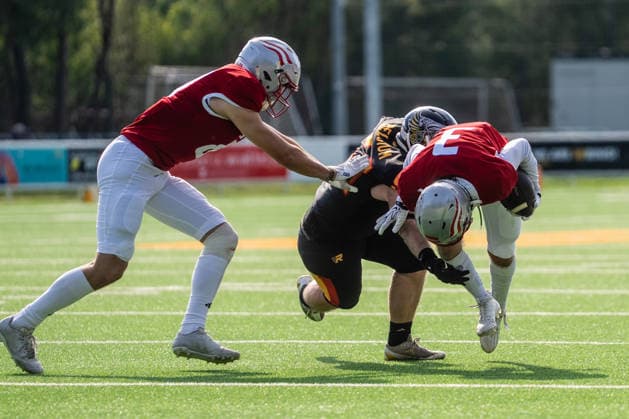 AMERICAN FOOTBALL - IFAF EC, AUT vs BEL SALZBURG,AUSTRIA,04.OCT.26 - AMERICAN FOOTBALL - IFAF European Championship, EM, Europameisterschaft Austria vs Belgium. Image shows Nathan Pollart (BEL) and Jonas Dachs-Wiesinger (AUT).  GEPAxpictures xJulioxArellano