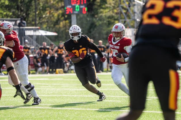 AMERICAN FOOTBALL - IFAF EC, AUT vs BEL SALZBURG,AUSTRIA,04.OCT.26 - AMERICAN FOOTBALL - IFAF European Championship, EM, Europameisterschaft Austria vs Belgium. Image shows Abdoulaye Sow (BEL) and Nick Holub (AUT).  GEPAxpictures xJulioxArellano