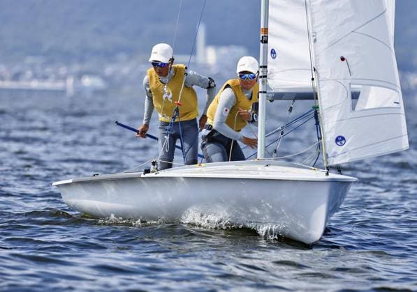 Aichi-Nagoya Asian Games: Sailing Japanese sailors Riho Sanematsu (R) and Misaki Tsunomori compete en route to winning the Aichi-Nagoya Asian Games youth mixed dinghy gold off Kaiyoh Yacht Harbor in Gamagori in Aichi Prefecture, central Japan, on Oct. 3, 2026.  A14AA0005630111P