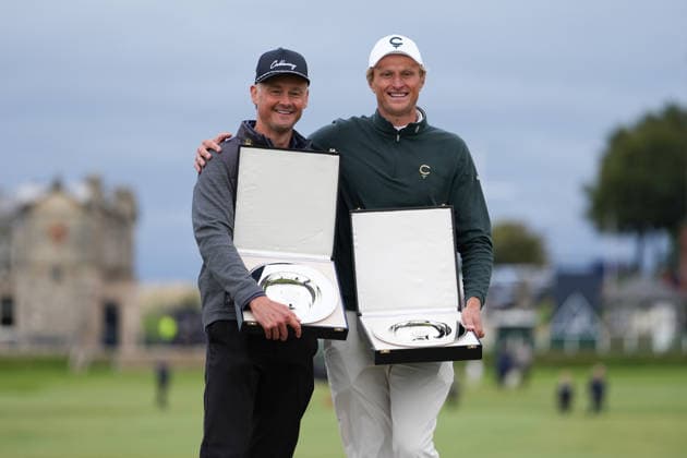 RECORD DATE NOT STATED 4th October 2026; Old Course at St Andrews, St Andrews, Scotland; DP World Tour Golf, Alfred Dunhill Links Championship, Final Day; Tom Chaplin and Adrian Meronk hold the team championship trophy on the Swilcan Bridge AlecxBrown