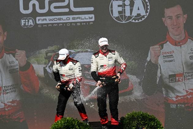 IPA89309436 - ,Driver Elfyn Evans and Co-Driver Scott Martin of the Toyota Gazoo Racing WRT team, driving the Toyota GR Yaris Rally1, celebrate their victory as champions during the FIA World Rally Championship WRC, Motorsport Rallye, WM Rally Italia Sardegna 2026 on October 4 in Alghero, Sardinia, Italy  Copyright: xLucaxBarsali IPAxSportx xx IPA89309436
