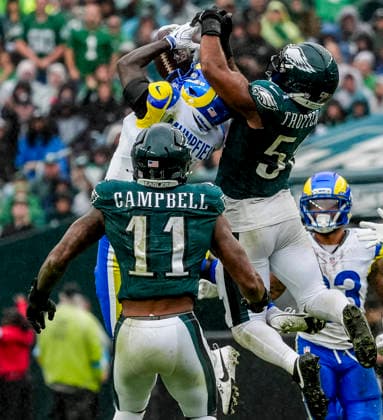October 4, 2026, Philadelphia, Pa, USA: Oct 4, 2026; Philadelphia, PA, USA; Philadelphia Eagles linebacker Jeremiah Trotter Jr. (54) and Los Angeles Rams wide receiver Konata Mumpfield (4) vying for a jump ball during the Rams 24-20 wins against the Eagles at Lincoln Financial Field. Mandatory Credit: -Cal Media Philadelphia USA - ZUMAcs17 20261004_faf_cs17_179 Copyright: xScottxSeriox