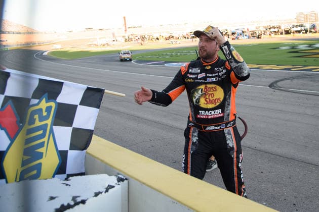 LAS VEGAS, NV - OCTOBER 04: Chase Briscoe ( 19 Joe Gibbs Racing Bass Pro Shops Toyota) receives the Sunoco checkered flag to celebrate winning the race during the NASCAR, Motorsport, USA Cup Series Playoffs South Point 400 on October 04, 2026, at Las Vegas Motor Speedway in Las Vegas, NV. (Photo by Chris Williams LVMS Icon Sportswire) AUTO: OCT 04 NASCAR Cup Series Playoffs South Point 400 EDITORIAL USE ONLY Icon0072610041261