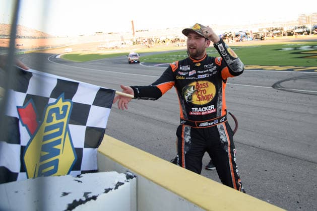 LAS VEGAS, NV - OCTOBER 04: Chase Briscoe ( 19 Joe Gibbs Racing Bass Pro Shops Toyota) receives the Sunoco checkered flag to celebrate winning the race during the NASCAR, Motorsport, USA Cup Series Playoffs South Point 400 on October 04, 2026, at Las Vegas Motor Speedway in Las Vegas, NV. (Photo by Chris Williams LVMS Icon Sportswire) AUTO: OCT 04 NASCAR Cup Series Playoffs South Point 400 EDITORIAL USE ONLY Icon0072610041262