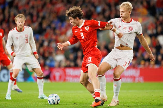 RECORD DATE NOT STATED 4th October 2026; Cardiff City Stadium, Cardiff, Wales; UEFA Nations League Football, Wales versus Denmark; Lewis Koumas of Wales shields ball from Oliver Provstgaard of Denmark AmandaxMcMaster