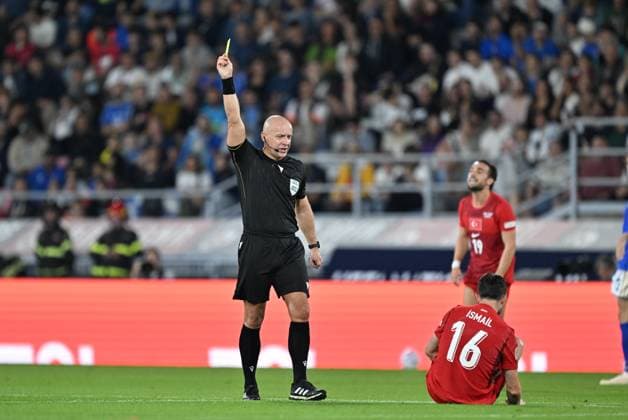 Italy v Turkiye - UEFA Nations League BOLOGNA, ITALY - OCTOBER 5: Polish referee Szymon Marciniak shows a yellow card to Ismail Yuksek (16) of Turkiye during the UEFA Nations League Group A1 match between Italy and Turkiye at Stadio Renato Dall Ara in Bologna, Italy on October 5, 2026. Mustafa Yalcin Anadolu Bologna Italy. Editorial use only. Please get in touch for any other usage. Copyright: x2026xAnadoluxMustafaxYalcinx