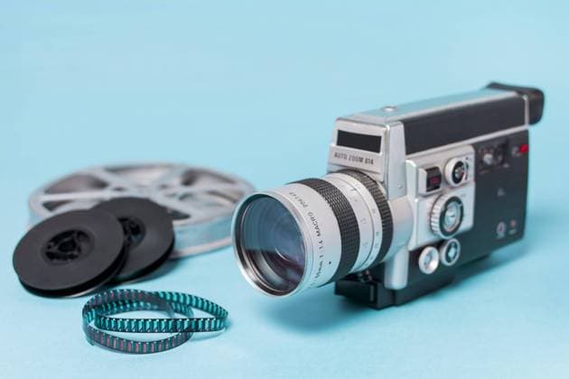 Film coils Filmstrips Vintage Camcorder Blue Background Copyright: imageBROKER OleksandrxLatkun ibxole08509487.jpg