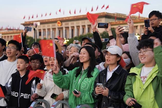 251001 -- BEIJING, Oct. 1, 2025 -- People attend a flag-raising ceremony marking the 76th anniversary of the founding of the People s Republic of China at Tian anmen Square in Beijing, capital of China, Oct. 1, 2025. CHINA-BEIJING-NATIONAL DAY-FLAG-RAISING CEREMONY CN XingxGuangli CHINA-BEIJING-NATIONAL DAY-FLAG-RAISING CEREMONY (CN) IMAGO XingxGuangli imago images 1067190039