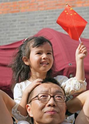 (251001) -- BEIJING, Oct. 1, 2025 -- People attend a flag-raising ceremony at the Memorial of the First National Congress of the Communist Party of China in east China s Shanghai, Oct. 1, 2025. The 76th anniversary of the founding of the People s Republic of China was observed on Wednesday in various ways across the country. ) CHINA-NATIONAL DAY-CELEBRATION (CN) LiuxYing