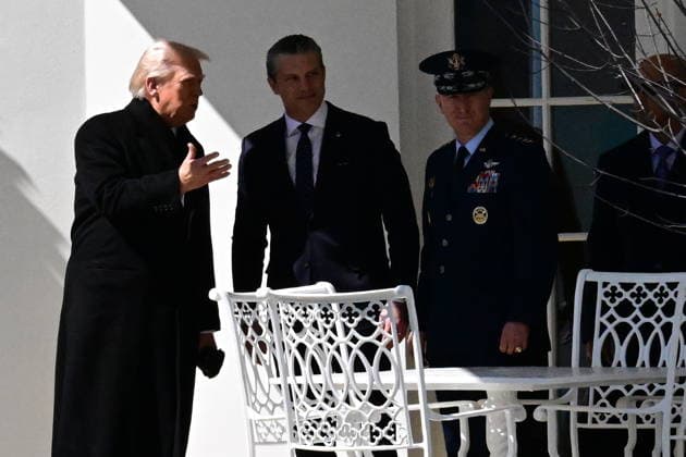 President Donald Trump Departs The White House (INT) President Donald Trump gestures a wave as he departs the White House with United States Secretary of War Pete Hegseth and United States Chairman of the Joint Chiefs of Staff Dan Caine in Washington, D.C., on March 18, 2026 for a trip to Dover Air Force Base for a dignified transfer where the remains of six U.S. service members killed in the crash of a refueling aircraft are returned to their families. It will be the second time since launching the war with Iran on Feb. 28 that the Republican president will attend the solemn military ritual known as a dignified transfer, which he once described as the toughest thing he has had to do as commander in chief. Credit: Kyle Mazza Thenews2  Copyright: xKylexMazzax