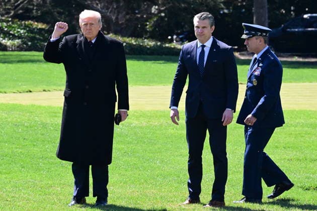 President Donald Trump Departs The White House (INT) President Donald Trump gestures a fist bump as he departs the White House with United States Secretary of War Pete Hegseth and United States Chairman of the Joint Chiefs of Staff Dan Caine in Washington, D.C., on March 18, 2026 for a trip to Dover Air Force Base for a dignified transfer where the remains of six U.S. service members killed in the crash of a refueling aircraft are returned to their families. It will be the second time since launching the war with Iran on Feb. 28 that the Republican president will attend the solemn military ritual known as a dignified transfer, which he once described as the toughest thing he has had to do as commander in chief. Credit: Kyle Mazza Then  Copyright: xKylexMazzax