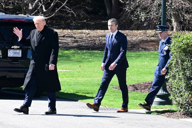 President Donald Trump Departs The White House (INT) President Donald Trump gestures a wave as he departs the White House with United States Secretary of War Pete Hegseth and United States Chairman of the Joint Chiefs of Staff Dan Caine in Washington, D.C., on March 18, 2026 for a trip to Dover Air Force Base for a dignified transfer where the remains of six U.S. service members killed in the crash of a refueling aircraft are returned to their families. It will be the second time since launching the war with Iran on Feb. 28 that the Republican president will attend the solemn military ritual known as a dignified transfer, which he once described as the toughest thing he has had to do as commander in chief. Credit: Kyle Mazza Thenews2  Copyright: xKylexMazzax
