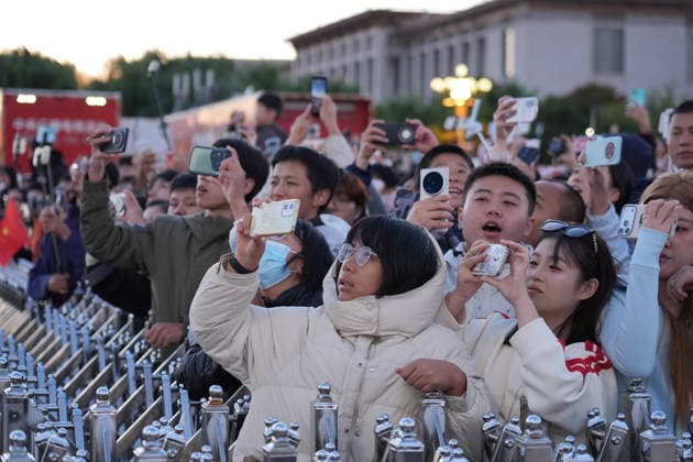 (261001) -- BEIJING, Oct. 1, 2026 -- People attend a flag-raising ceremony marking the 77th anniversary of the founding of the People s Republic of China at Tian anmen Square in Beijing, capital of China, Oct. 1, 2026. ) CHINA-BEIJING-NATIONAL DAY-FLAG-RAISING CEREMONY (CN) XiexHan