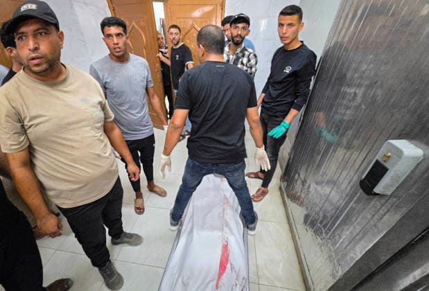 Body of Palestinian Killed in Khan Younis Strike Taken to Nasser Medical Complex Palestinians carry the body of 36-year-old Moaz Jamal Abu Nusaira to Nasser Medical Complex on October 4, 2026, after he was killed in an Israeli airstrike that targeted him north of Khan Younis, in the southern Gaza Strip. Photo by Tariq Mohammad APA Images Khan Yunis Gaza Strip Palestinian Territory 041026_Khan_Yunis_TM_00(2) Copyright: xapaimagesxTariqxMohammad xapaimagesx