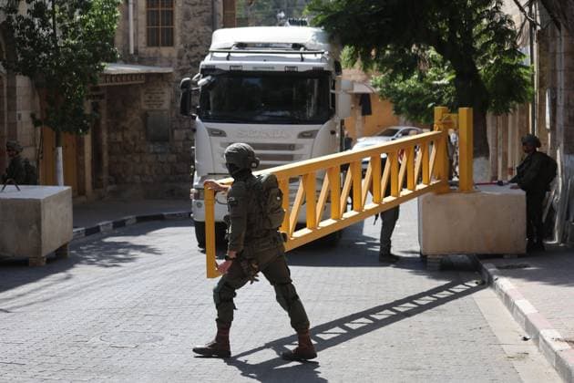 October 4, 2026, Hebron, Palestine, State of: HEBRON, OCCUPIED WEST BANK, OCTOBER 4, 2026: Newly installed Israeli military gates are seen near entrances to Hebron s Old City as Israeli forces impose additional movement restrictions in the area. One of the new iron gates was installed in the Al-Zahid area, a key route connecting neighborhoods of the Old City and providing access toward the Ibrahimi Mosque. Local shop owner Badr al-Tamimi said the restrictions were affecting access to more than 1,000 commercial shops and over 500 homes in the area. Hebron Palestine, State of - ZUMAq101 20261004_zna_q101_081 Copyright: xMosabxShawerx