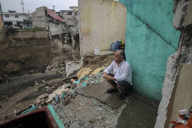 Heavy rains linked to El Nino trigger severe land collapse in Guatemala SAN MIGUEL PETAPA, GUATEMALA - OCTOBER 04: Residents try to go on with their daily lives amid severe damage and collapsed structures in the Villa Hermosa I neighborhood following relentless rainfall and the overflow of the Pinula River in San Miguel Petapa, Guatemala on October 04, 2026. The rising waters, linked to the El Nino phenomenon, triggered extensive riverbank erosion and land loss, damaging several homes and leaving nearby properties at continuous risk of collapse. Luis Vargas Anadolu San Miguel Petapa Guatemala. Editorial use only. Please get in touch for any other usage. Copyright: x2026xAnadoluxLuisxVargasx