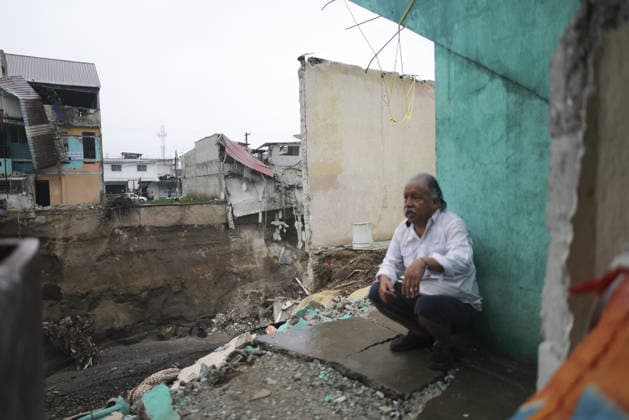 Heavy rains linked to El Nino trigger severe land collapse in Guatemala SAN MIGUEL PETAPA, GUATEMALA - OCTOBER 04: Residents try to go on with their daily lives amid severe damage and collapsed structures in the Villa Hermosa I neighborhood following relentless rainfall and the overflow of the Pinula River in San Miguel Petapa, Guatemala on October 04, 2026. The rising waters, linked to the El Nino phenomenon, triggered extensive riverbank erosion and land loss, damaging several homes and leaving nearby properties at continuous risk of collapse. Luis Vargas Anadolu San Miguel Petapa Guatemala. Editorial use only. Please get in touch for any other usage. Copyright: x2026xAnadoluxLuisxVargasx