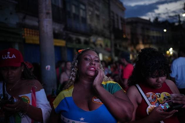 October 4, 2026, Rio De Janeiro, Brazil: RIO DE JANEIRO, BRAZIL, OCTOBER 4, 2026: Supporters of Brazilian President Luiz Inacio Lula da Silva gather in Rio de Janeiro to follow the results of the first round of Brazil s presidential election. Senator Flavio Bolsonaro finished first with 47.03 percent of valid votes, while Lula received 45.16 percent, sending the presidential race to a runoff after neither candidate secured an outright majority. The second round is scheduled for October 25 Rio De Janeiro Brazil - ZUMAq101 20261004_zna_q101_170 Copyright: xMarianaxGreifx