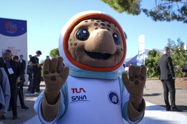 World’s largest annual gathering dedicated to space opens in Turkiye’s Antalya ANTALYA, TURKIYE - OCTOBER 05: Turquoise, the official Caretta caretta mascot of the 77th International Astronautical Congress (IAC), interacts with delegates during the opening day of the global summit at the NEST Convention Center in Antalya, Turkiye on October 05, 2026. Organized by the International Astronautical Federation (IAF), coordinated by the Turkish Ministry of Industry and Technology, and co-hosted by the Turkish Space Agency (TUA) and SAHA Istanbul, the event features the mascot welcoming space professionals and attendees from around the world. Beyza Comert Anadolu Antalya Turkey. Editorial use only. Please get in touch for any other usage. Copyright: x2026xAnadoluxBeyzaxComertx
