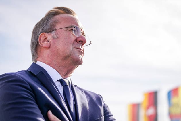 Germany, Emden: Federal Minister of Defense Boris Pistorius gazes into the distance during a press conference on the decision regarding the German Navy’s new naval base in Emden. Flags are visible in the background. Portrait, side profile, low-angle shot, Boris Pistorius, Federal Minister of Defense, Federa Copyright: xJOERANxSTEINSIEKx