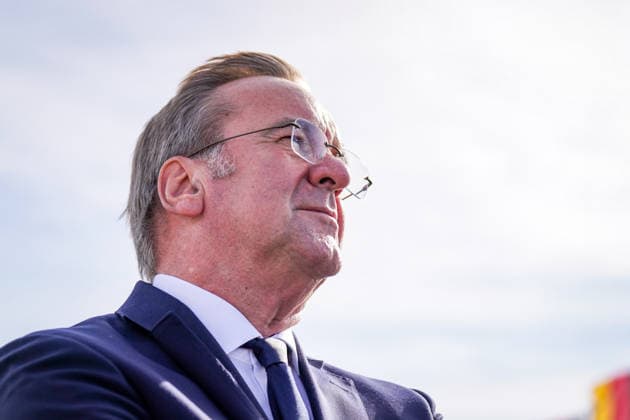 Germany, Emden: Federal Minister of Defense Boris Pistorius gazes into the distance during a press conference on the decision regarding the German Navy’s new naval base in Emden. Flags are visible in the background. Portrait, side profile, low-angle shot, Boris Pistorius, Federal Minister of Defense, Federa Copyright: xJOERANxSTEINSIEKx