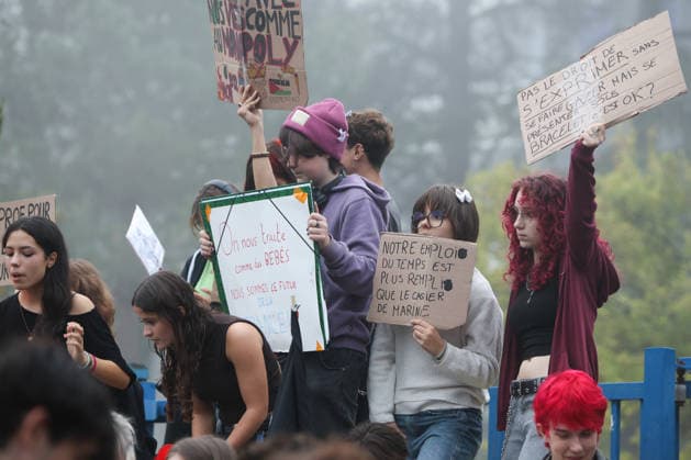 October 5, 2026, Bayonne, Nouvelle Aquitaine, France: High school students hold placards, one reading Not allowed to speak out without getting gassed, but showing up wearing an ankle bracelet is OK? and another Our schedule is more packed than Marine s criminal record , during a protest against the government outside the Reno Cassin high school in Bayonne, southwestern France, on October 5, 2026. Students have been blocking schools across France since September 21 to demand more teachers, smaller classes and better school buildings. Bayonne France - ZUMAb298 20261005_zsp_b298_017 Copyright: xJulesxBuonx
