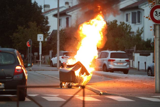 October 5, 2026, Anglet, Nouvelle Aquitaine, France: A waste container burns in the street during a protest by high school students against the government outside the Cantau high school in Anglet, southwestern France, on October 5, 2026. Students have been blocking schools across France since September 21 to demand more teachers, smaller classes and better school buildings. Cantau was closed by authorities after clashes in recent days. Anglet France - ZUMAb298 20261005_zsp_b298_013 Copyright: xJulesxBuonx