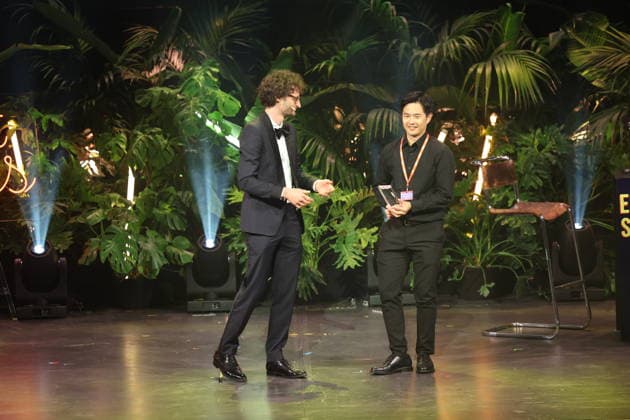 FIRST STEPS 2026: Laudatory speech by Karl Schirnhofer and winner of the Short Film category; winning film *BAN DAL* by Hae Sup Sin; award ceremony on stage at the FIRST STEPS 2026 awards ceremony at the Theater des Westens in Berlin Copyright: xEventpressxFuhrx