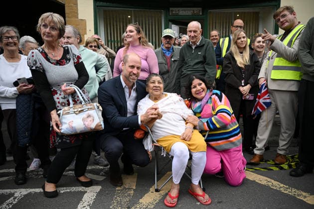 The Prince Of Wales Visits Ilminster ILMINSTER, ENGLAND - OCTOBER 06: Prince William, Prince of Wales poses with locals during his visit to Sweet Surprise cafe on October 06, 2026 in Ilminster, England. The Prince of Wales visited Ilminster in Somerset to learn about communities growing their resilience to wild fires, flood and challenges caused by extreme weather and global warming., Credit:Finnbarr Webster PA ROTA - B68 Avalon United Kingdom, England, Ilminster Copyright: xFinnbarrxWebsterx xPAxROTAx-xB68x xAvalonx 1141004098