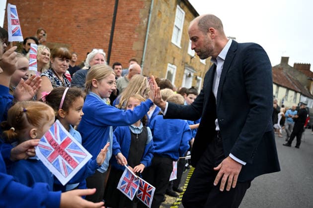 The Prince Of Wales Visits Ilminster ILMINSTER, ENGLAND - OCTOBER 06: Prince William, Prince of Wales, high-fives members from the local school during his visit to Sweet Surprise cafe on October 06, 2026 in Ilminster, England. The Prince of Wales visited Ilminster in Somerset to learn about communities growing their resilience to wild fires, flood and challenges caused by extreme weather and global warming., Credit:Finnbarr Webster PA ROTA - B68 Avalon United Kingdom, England, Ilminster Copyright: xFinnbarrxWebsterx xPAxROTAx-xB68x xAvalonx 1141004136