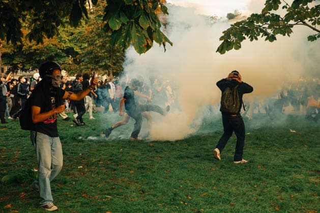 Paris Students Protest Education Conditions Two demonstrators run across a grassy area as tear gas drifts behind them in Paris, France, on October 6, 2026. France s Interior Ministry said 256,000 people marched nationwide, including 56,000 in Paris, during the student-led day of action over school conditions. High school students called for more education funding and staff, smaller classes and improved facilities, with teachers, parents and unions joining demonstrations. Paris Ile de France France Copyright: xDavoodxMaeilix