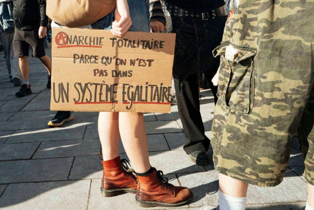 High School And University Student Protest - Toulouse A placard – Totalitarian anarchy - because we do not live in an egalitarian system. Protests by secondary school pupils and students calling for improvements to their living and learning conditions, supported by the trade unions CGT, FO, FSU and Solidaires. France, Toulouse, 6 October 2026. Photo by Patricia Huchot-Boissier AbacaPress.com. Toulouse OCCITANIE France Copyright: xHuchot-BoissierxPatricia ABACAx