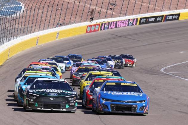 LAS VEGAS, NV - OCTOBER 15: Brad Keselowski ( 6 RFK Racing BuildSubmarines.com Ford) and Kyle Larson ( 5 Hendrick Motorsports HendrickCars.com Chevrolet) lead the field of cars up to the start line during the NASCAR, Motorsport, USA Cup Series Playoff South Point 400 race Sunday, Oct. 15, 2023, at the Las Vegas Motor Speedway in Las Vegas, Nevada. (Marc Sanchez Icon Sportswire) AUTO: OCT 15 NASCAR Cup Series Playoff South Point 400 EDITORIAL USE ONLY Icon1442310153819