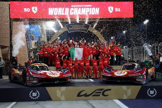 Ferrari 499P 50 drivers Alessandro Pier Guidi ITA , James Calado GBR , Antonio Giovanazzi ITA , Alessandro Pier Guidi ITA , James Calado GBR , Antonio Giovanazzi ITA and all Ferrari AF Corse team members and the Ferrari 499P 51 Ferrari in the shower of confetti on the world championship podium after the race, 8 Hours of Bahrain, FIA World Endurance Championship 2026 season, Sakhir race track, Bahrain, 08 11 2025, WEC, joint cheering picture for the driver and manufacturer world championship title