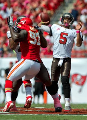 Oct. 14, 2012 - Tampa, FL, USA - Tampa Bay Buccaneers quarterback Josh Freeman (5) passes over the pressure of Kansas City Chiefs defensive end Allen Bailey (97) in the second quarter at Raymond James Stadium in Tampa, Florida, Sunday, October 14, 2012. The Buccaneers defeated the Chiefs, 38-10. Copyright: xDavidxEulittx
