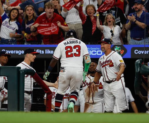 Atlanta Braves centerfielder Michael Harris, II is greeted in the dugout after hitting a 2-run home run in the fourth inning during the game against the Kansas City Royals at Truist Park on Friday, March 27, 2026 in Atlanta, Georgia. ATL20260327122 MikexZarrilli